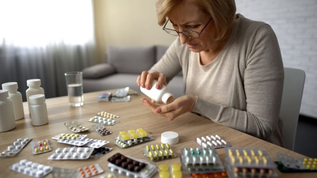 Woman taking her medications